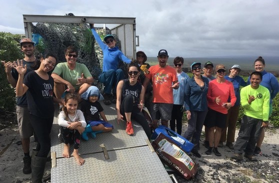 Beach cleanup volunteers pictured next to the 866 pounds of collected trash. 