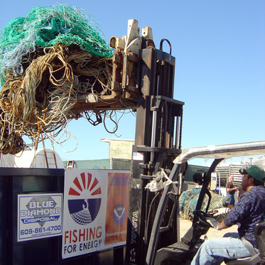 Fishing gear getting loaded into a collection bin.