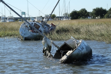 Abandoned and derelict vessels in a salt marsh.