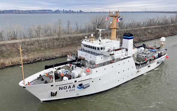 An image of NOAA Ship Thomas Jefferson shown from the bridge wing of a passing ship outside of Montreal, Quebec.