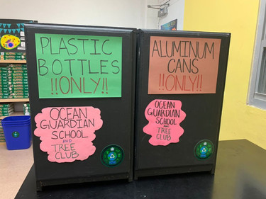 Recycling bins with student created signage. 