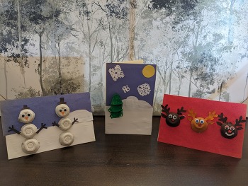 Three holiday cards made with upcycled egg cartons.