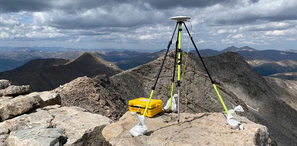 Surveying tripod in the mountains