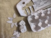 The turkey pieces cut out of the egg carton.