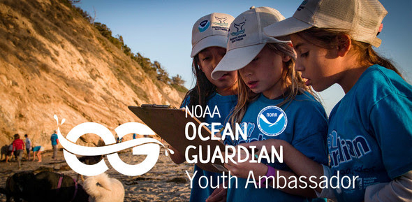 Advertisement for NOAA Ocean Guardian Youth Ambassador Program Three young girls on a beach looking at a clipboard