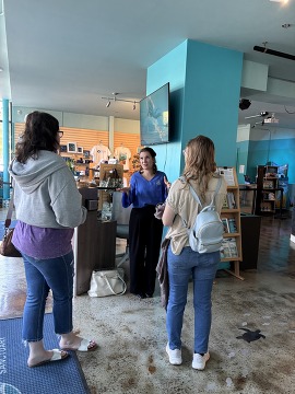 People inside a visitor center.