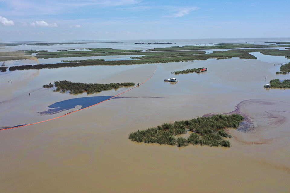 An overflight displays oil and gas mixture in an area of marsh environment near Garden Island Bay, Louisiana.