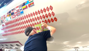 Hurricane Lee decal being added to a NOAA WP-3D Hurricane Hunter aircraft