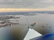 The collapsed Francis Scott Key bridge as seen from a NOAA King Air aircraft