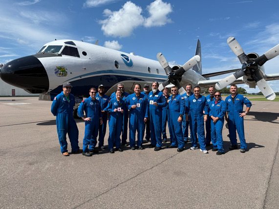P-3 Crew poses with penny patches after mission flight