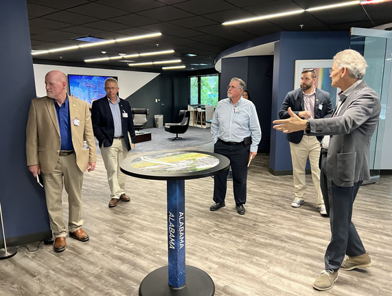 NPS faculty look around a creative space at Lockheed Martin