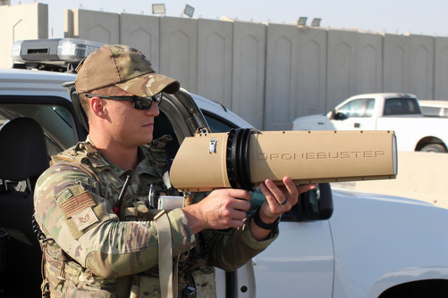 Air Force security forces officer holds a Dronebuster
