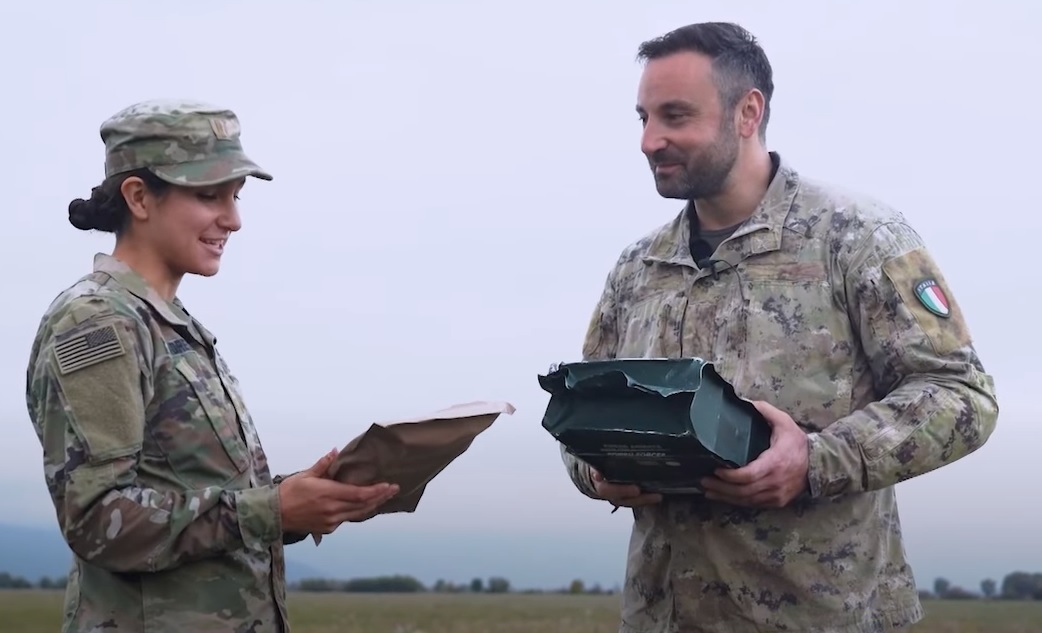 American and Italian military members exchange ration kits