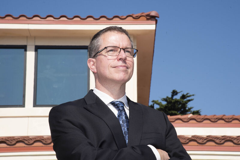 Chris Paul stands on the NPS campus