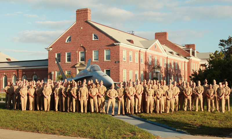 Naval aviators stand at naval Air Station Pensacola