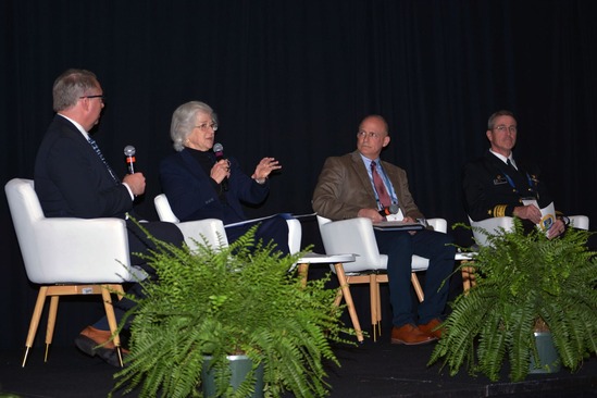 Rondeau on stage with other panelists