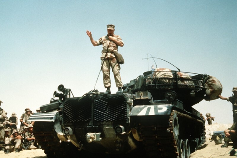 Gen Gray stands atop an M-60 main battle tank