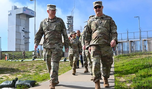 Space Force leaders walk at a launch facility