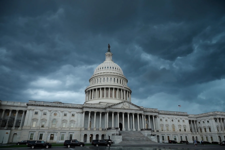 Capitol with dark cloudy sky