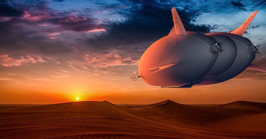 airship floating over a dessert at sunset
