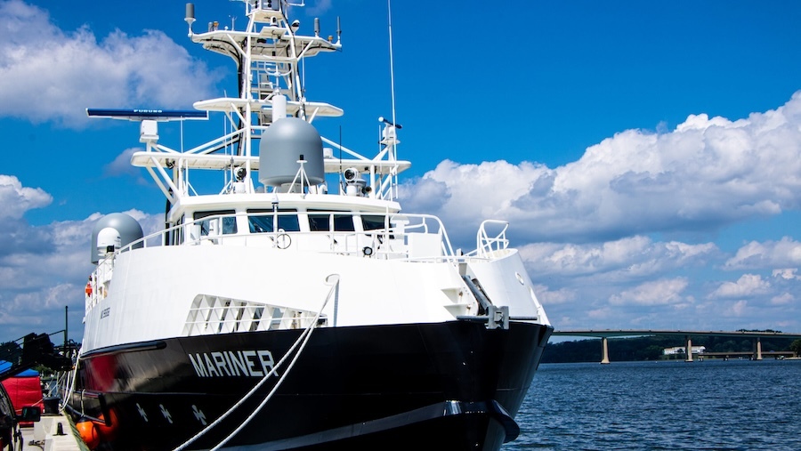 Ship at dock, bright blue sky