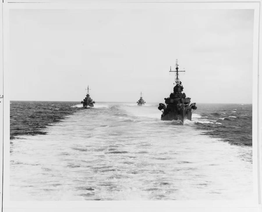 black-and-white photo of three ships headed toward the camera