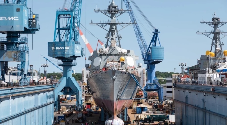front view of ship under construction, cranes on either side