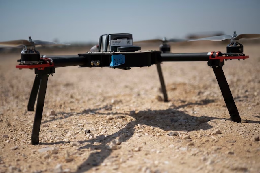 drone sitting on dirt field