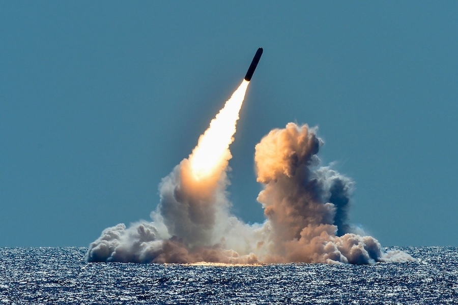 missile being launched over the ocean
