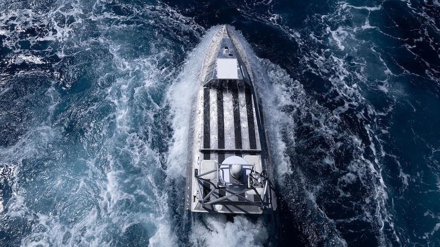 aerial view of a boat in frothy water