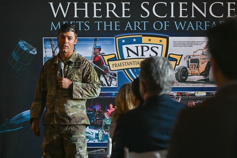 man in fatigues holding microphone