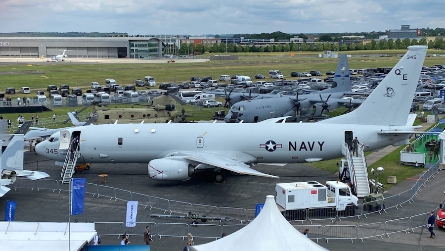 Navy plane sitting on an airfield