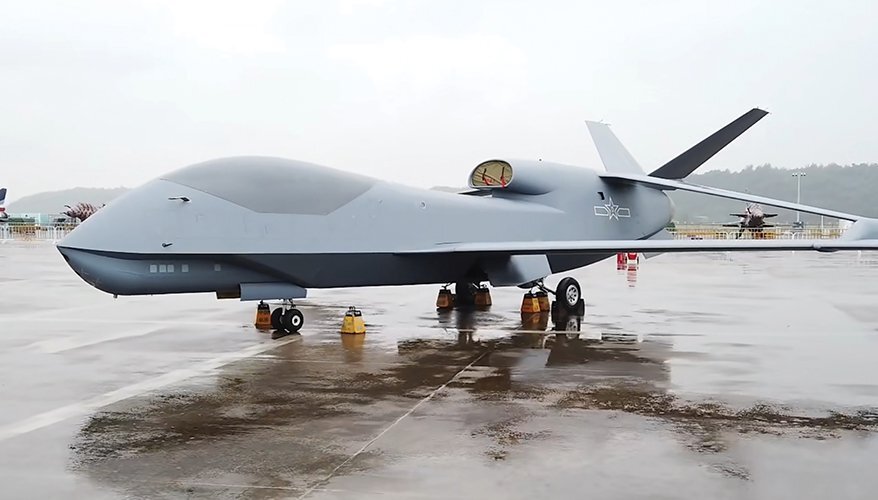 large silver drone parked on tarmac
