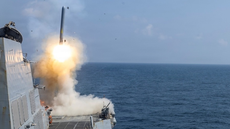 missile launching from a ship at sea
