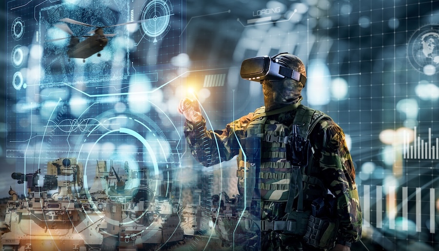 A soldier wears virtual reality glasses