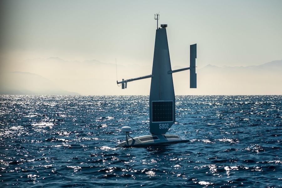 unmanned vessel sails on dark blue water