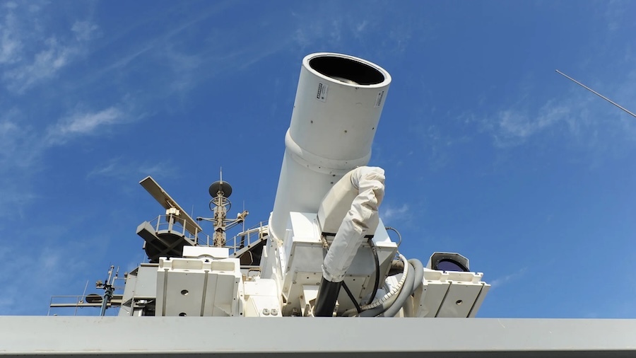 white laser weapon pointed at sky