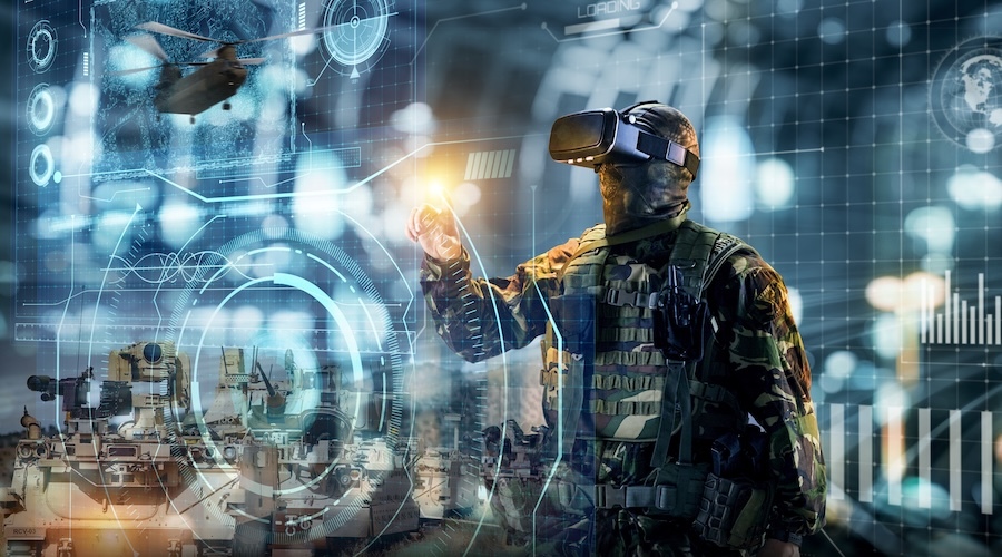 solider wearing virtual reality glasses, standing behind a transparent touchscreen