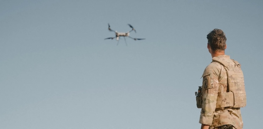 soldier watches a drone fly