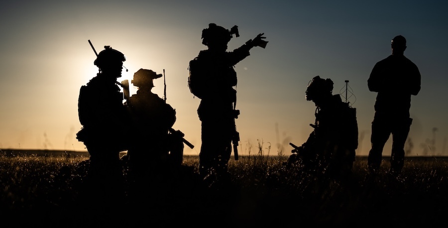 silhouettes of soldiers in tactical gear