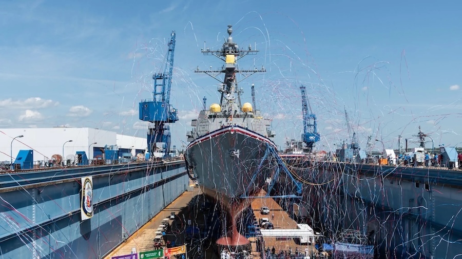 ship in dry dock with red white and blue bunting and streamers