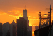 An orange sunset on a hot summer evening in New York City.