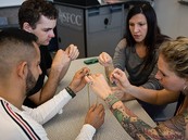 A group of students work together at a table