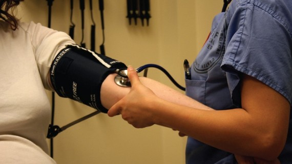 taking blood pressure