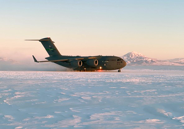 C17 on snow with mountains in the background