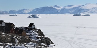 Landscape of arctic community next to a frozen lake