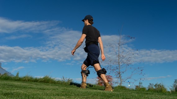 man walking in field