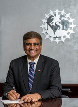 director panch portrait with NSF logo in background