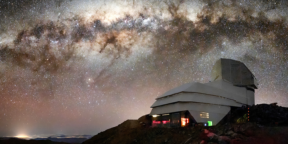 The Rubin Observatory facility pictured against the Milky Way galaxy.