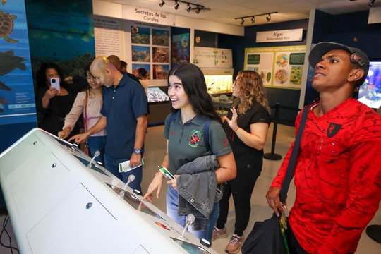 students interacting with a console